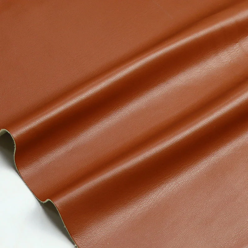 Jacka i mjuk mocka i syntetiskt läder